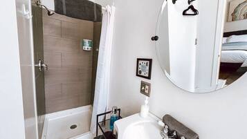 Shower, hair dryer, towels, shampoo