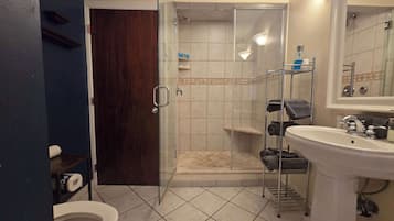 Shower, hair dryer, towels, shampoo
