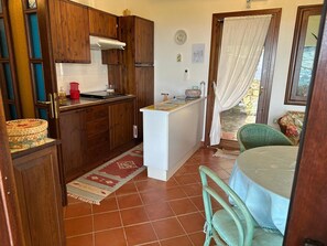 Fridge, microwave, stovetop, cookware/dishes/utensils