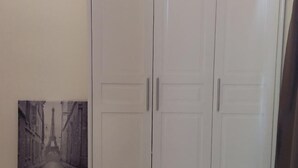 A room with a wardrobe featuring two doors and a single hanging wardrobe door. - Sweet home Ch 1 (Tanah Rata)