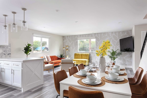 Bright dining area with elegant table setting and open layout