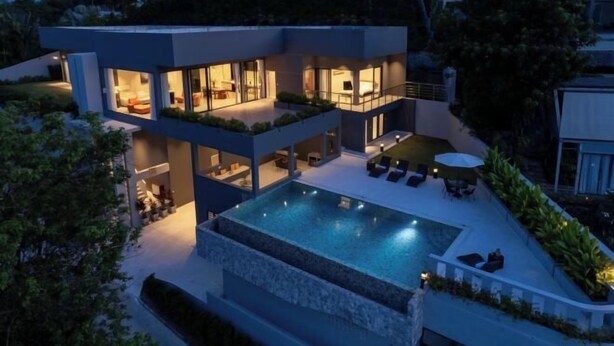 A modern two-story house with a swimming pool, outdoor seating, and a well-lit interior. - THE GREEN LOTUS SAMUI (Koh Samui)