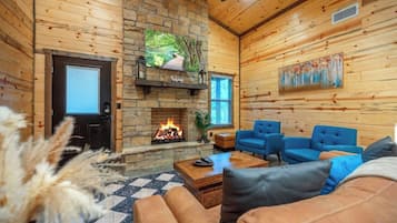 Signature Cabin, 2 Bedrooms, Private Pool | Living room | 50-inch Smart TV with digital channels, fireplace