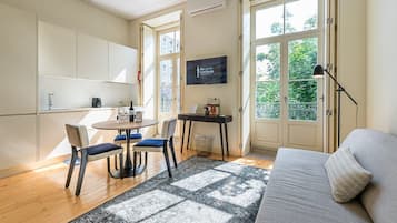Apartment (One-Bedroom Apartment) | Living area | 32-inch flat-screen TV with digital channels
