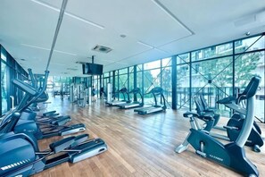 A gym with treadmills, elliptical machines, and weight equipment. - The Shore Kids Wonderland I Family 10Pax I Kids Friendly I JonkerSt (Melaka)
