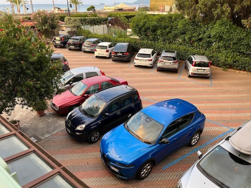 A parking lot with multiple cars parked in designated spaces.