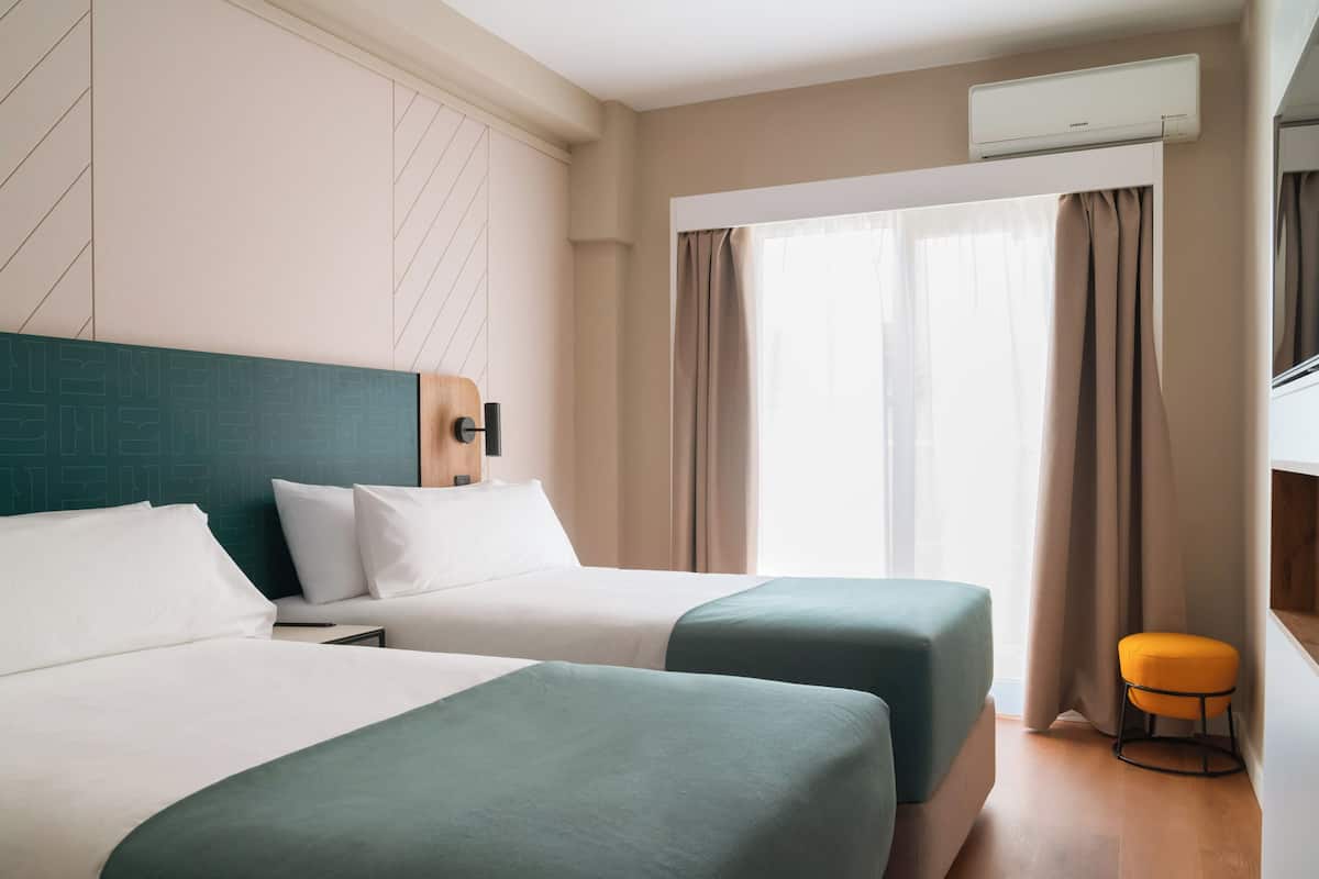 Twin Room with Balcony | Desk, laptop workspace, blackout curtains, free WiFi