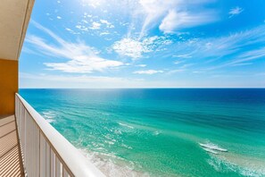 A balcony with a view of the ocean and a clear sky. - Treasure Island 1102 (Panama City Beach)