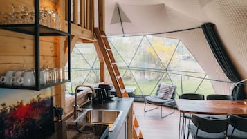 Fridge, stovetop, coffee/tea maker, dining tables