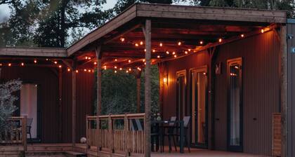 Three cosy lodges for 12 guests with nature views, own kitchen and modern rain shower bathroom.