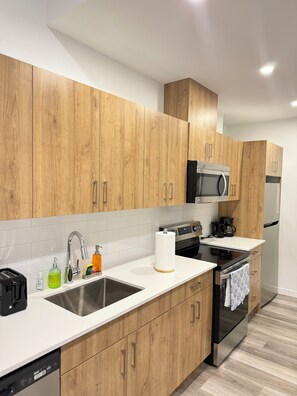 Microwave, oven, stovetop, dishwasher - Cozy 1 Bedroom near Rogers Place Heart of Downtown (Edmonton)