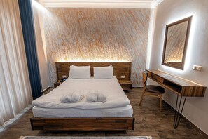 Deluxe Suite, Garden View | Premium bedding, free minibar items, in-room safe, desk