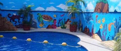Outdoor pool, open 9:00 AM to 10:00 PM, pool umbrellas