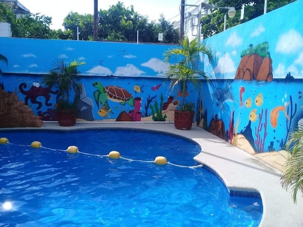 Outdoor pool, open 9:00 AM to 10:00 PM, pool umbrellas