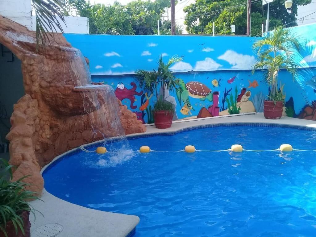Outdoor pool, open 9:00 AM to 10:00 PM, pool umbrellas