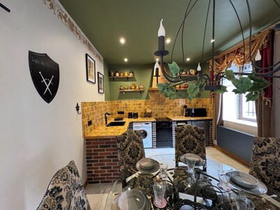 Medieval-themed accommodation; restored mansion with whirlpool bath