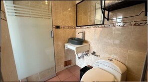 Shower, towels, soap, toilet paper