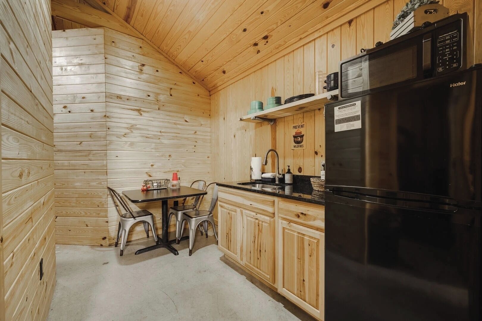 Fridge, coffee/tea maker, cookware/dishes/utensils, dining tables