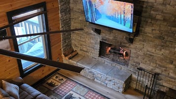 Smart TV, fireplace, foosball, books