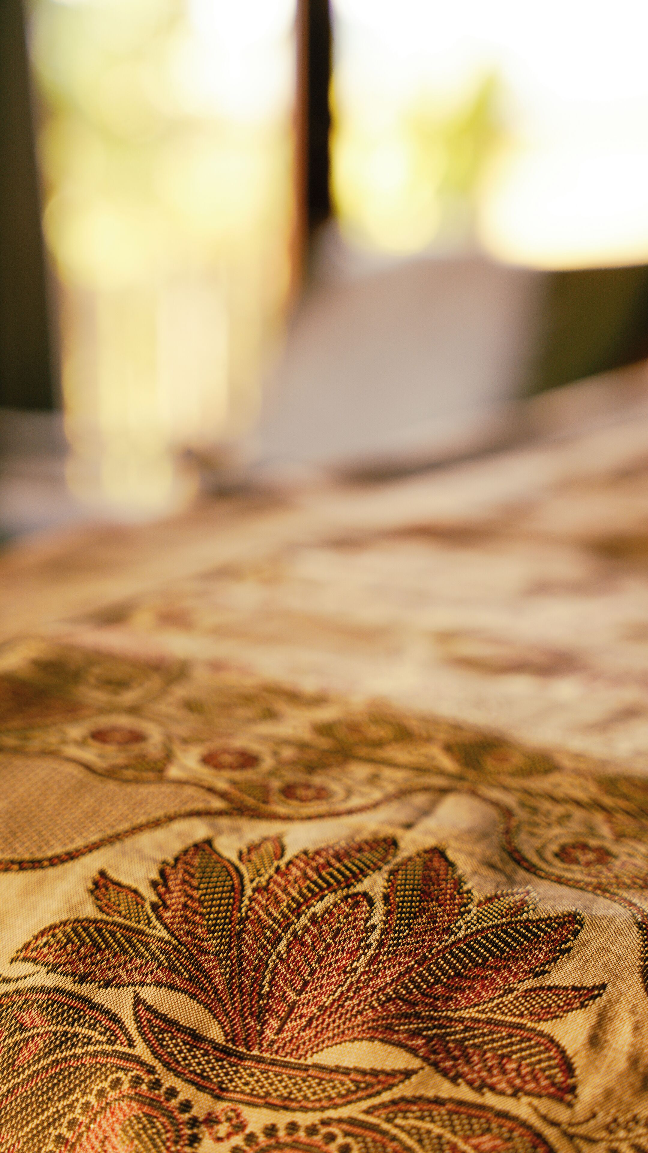 A close-up of a patterned fabric with a floral design.