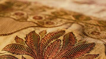 A close-up of a patterned fabric with a floral design.