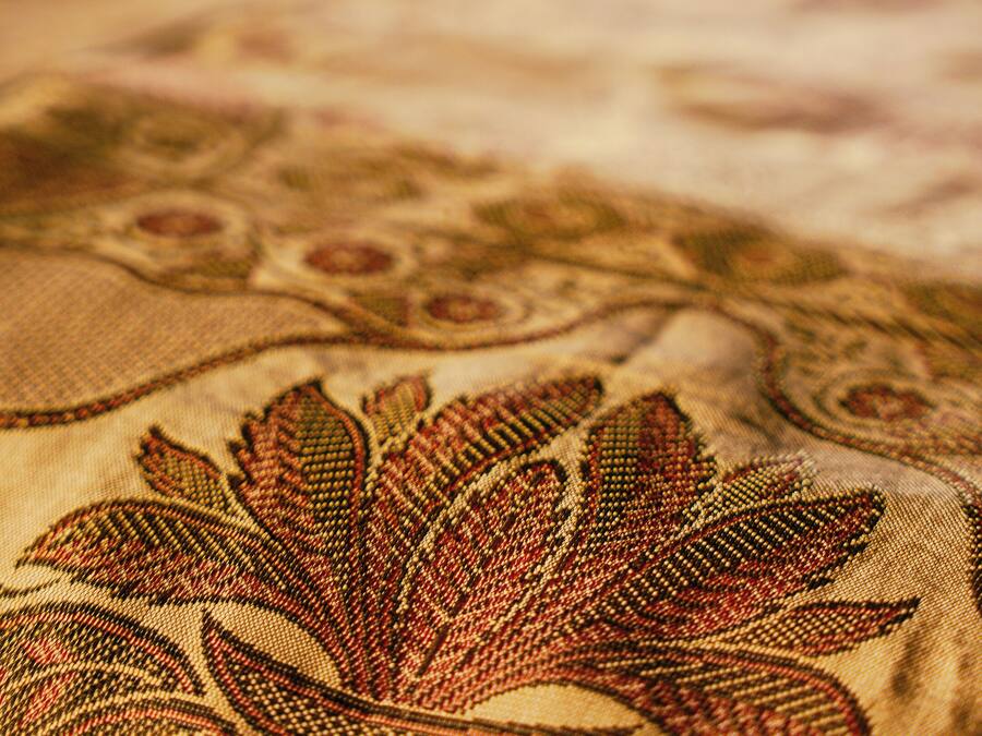 A close-up of a patterned fabric with a floral design.