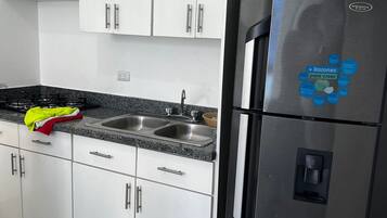 Fridge, microwave, cookware/dishes/utensils