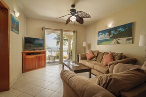 2 Bedroom Beachfront | Living area | TV - Pelican Reef Villas Resort (San Pedro)