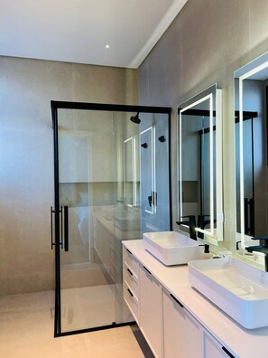 Shower, hair dryer, towels, soap