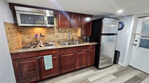 Fridge, microwave, stovetop, coffee/tea maker