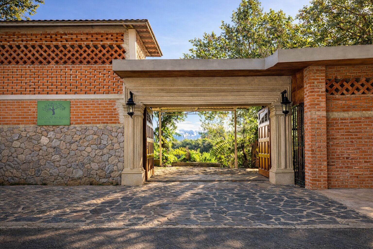 A stone pathway leading to a building with a brick facade and a green sign.
