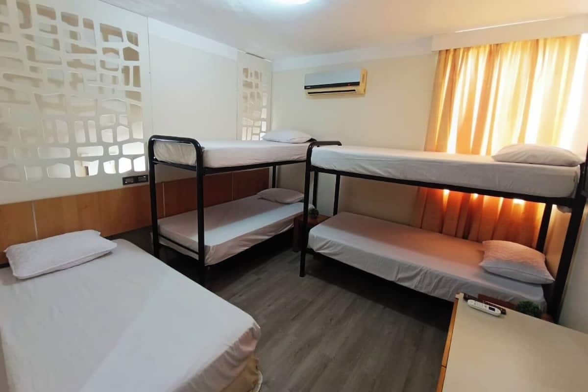 Economy Quadruple Room, Garden View | In-room safe, desk, laptop workspace, iron/ironing board