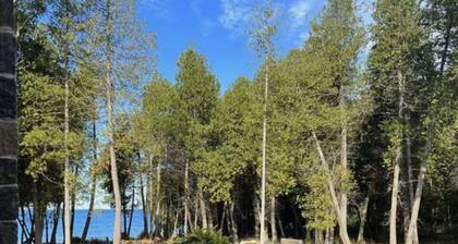 Cozy Lake Home Located on Marquette Island Surrounded by Water Beautiful Sunsets