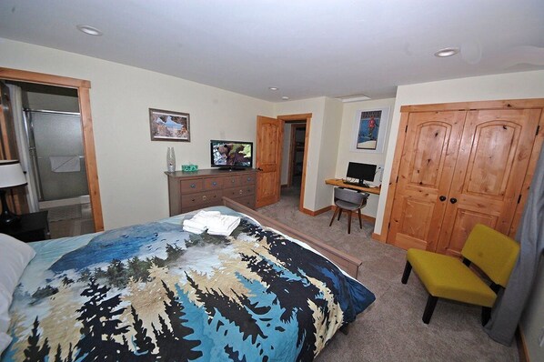 A bedroom with a bed, a desk, a chair, and a wardrobe. - Pet Friendly Home with 4 Bedrooms, Sleeping 8- Private Hot Tub, Blocks to Heavenly! 3826R~ (South Lake Tahoe)