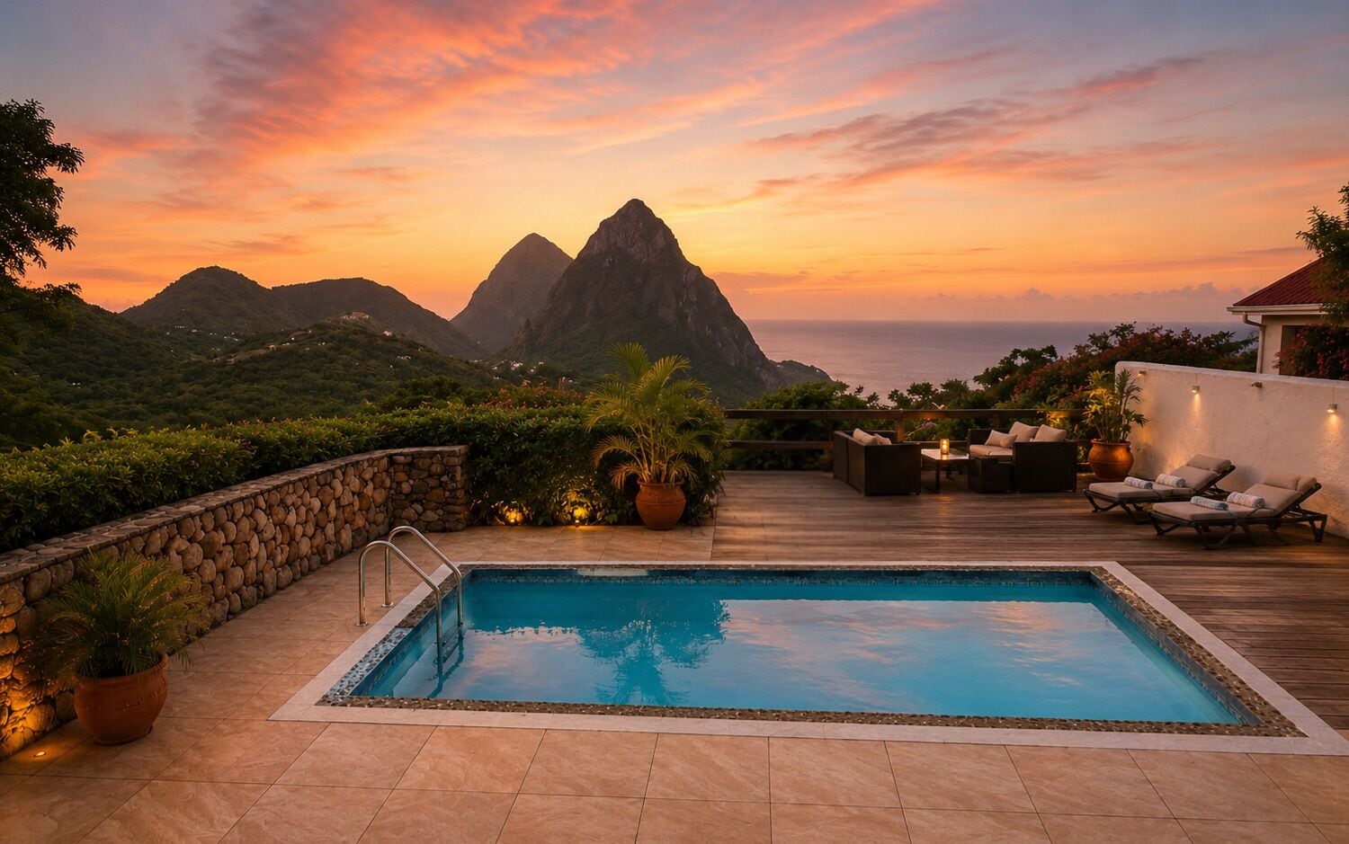 A rooftop pool with a view of mountains at sunset.