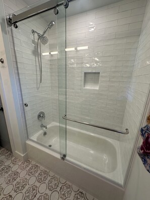 Shower, hair dryer, towels, soap