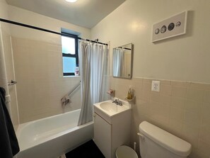 Bathroom - Live like a local in Fort Greene with views of the World Trade Center. Spacious apartment with a large bedroom, sofa bed for two, full kitchen with gas stove, hardwood floors, and bright living/dining area. Elevator building with on-site laundry. (Brooklyn)