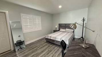 1 bedroom, desk, iron/ironing board, travel crib