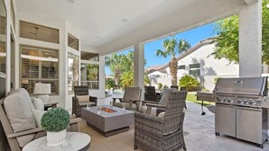 An outdoor patio with seating, a fire pit, and a grill. - Sol - Pool & Hot Tub - Mins to TPC Scottsdale (Scottsdale)