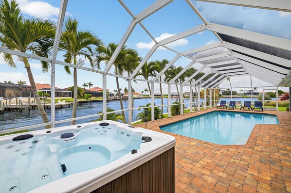Outdoor pool, a heated pool - The Cape Escape! Waterfront/heated pool/hot tub/sunsets; Burnt Store Area! (Cape Coral)