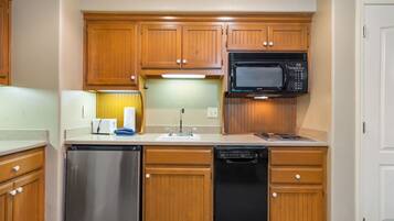 Fridge, microwave, coffee/tea maker, cookware/dishes/utensils