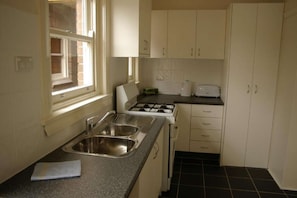 Fridge, microwave, oven, stovetop - Accommodation Sydney | Two-Bedroom Apartment with Balcony and Study (Rockdale)