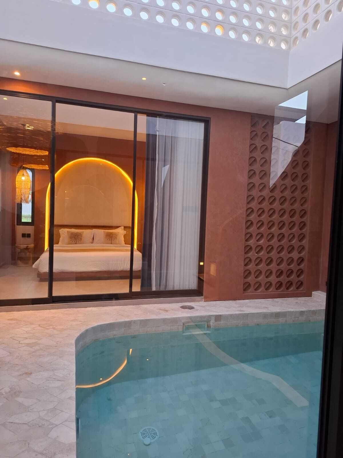 Indoor pool, outdoor pool, pool umbrellas, pool loungers