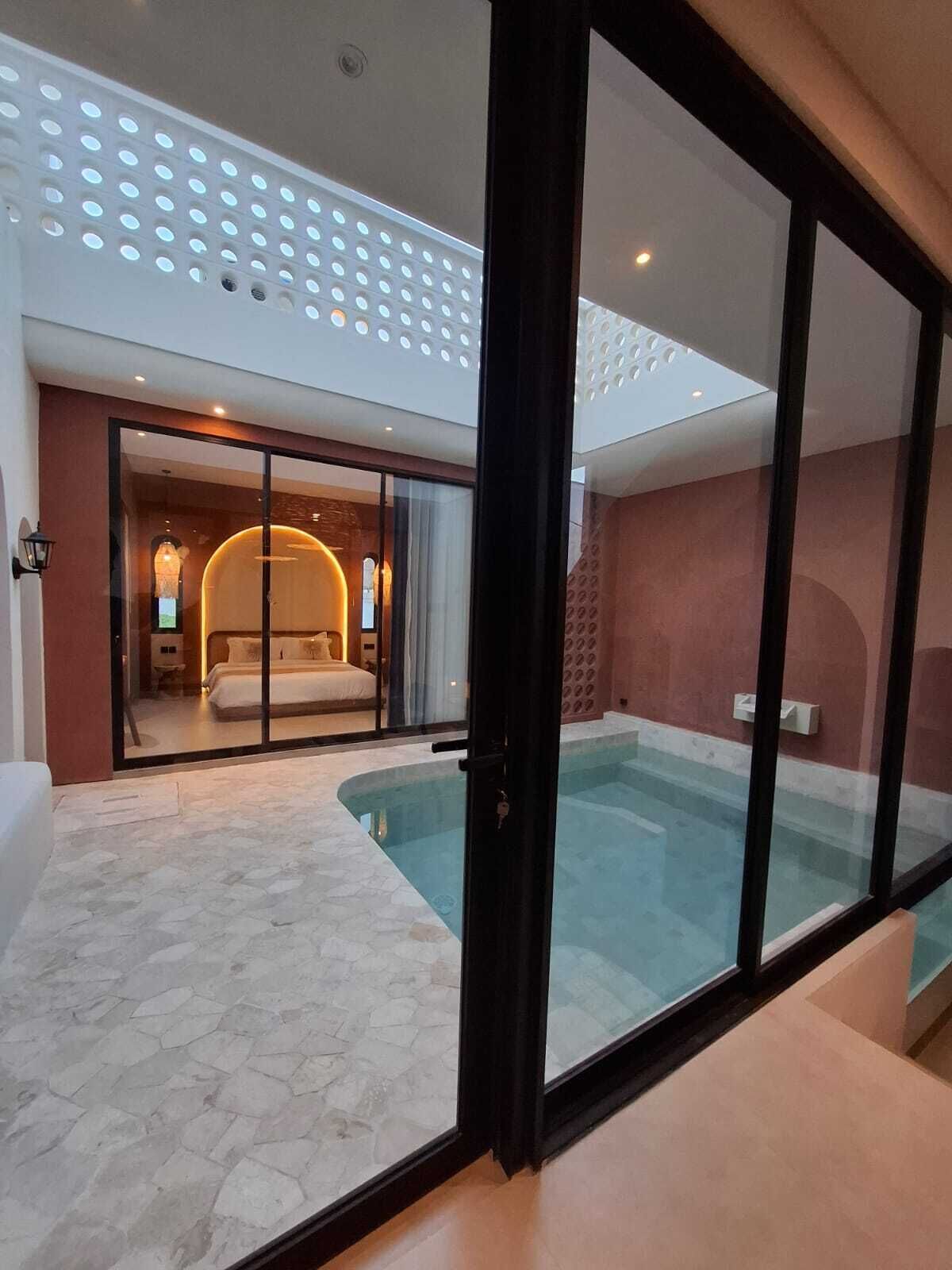 Indoor pool, outdoor pool, pool umbrellas, pool loungers