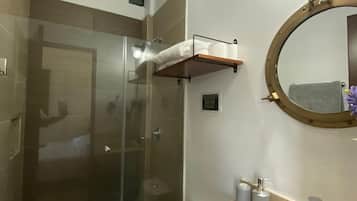 Shower, towels, soap, toilet paper
