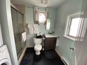 Shower, hair dryer, towels, soap