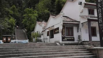 A traditional Japanese building with a staircase leading up to the entrance.