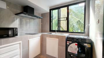 Family Loft, Garden View | Private kitchen | Fridge, stovetop, eco-friendly cleaning products, freezer