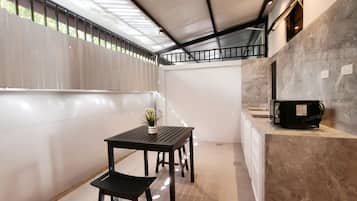 Family Suite, Garden View | Private kitchen | Fridge, stovetop, eco-friendly cleaning products, freezer