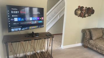 Deluxe House, Patio | Living area | Flat-screen TV
